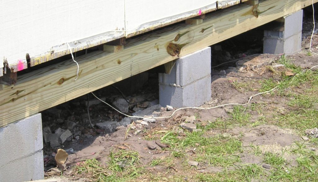 A concrete block sitting on top of the ground.