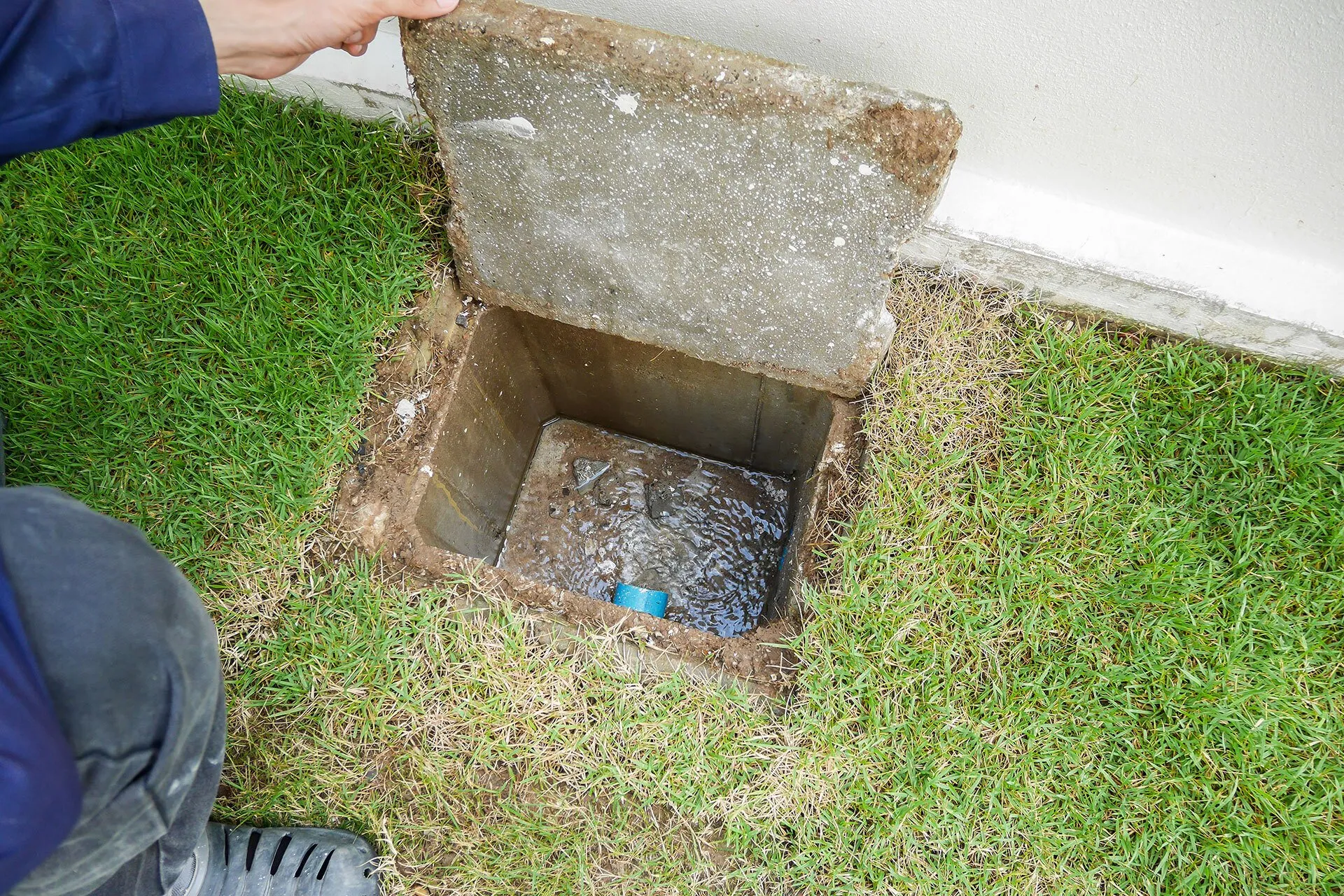 A hole in the ground with a box on it