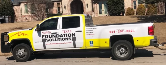 A truck parked in front of a house.